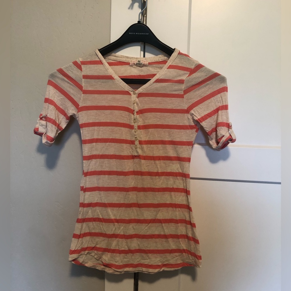 Pink and white striped shirt sleeve